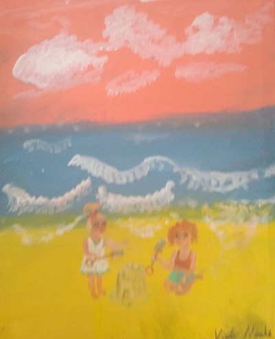 Two young children playing on a beach
