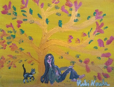 Girl with cat under the golden glory tree